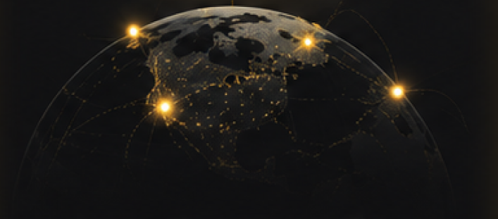 Globe at night with golden light points marking remote buyer locations